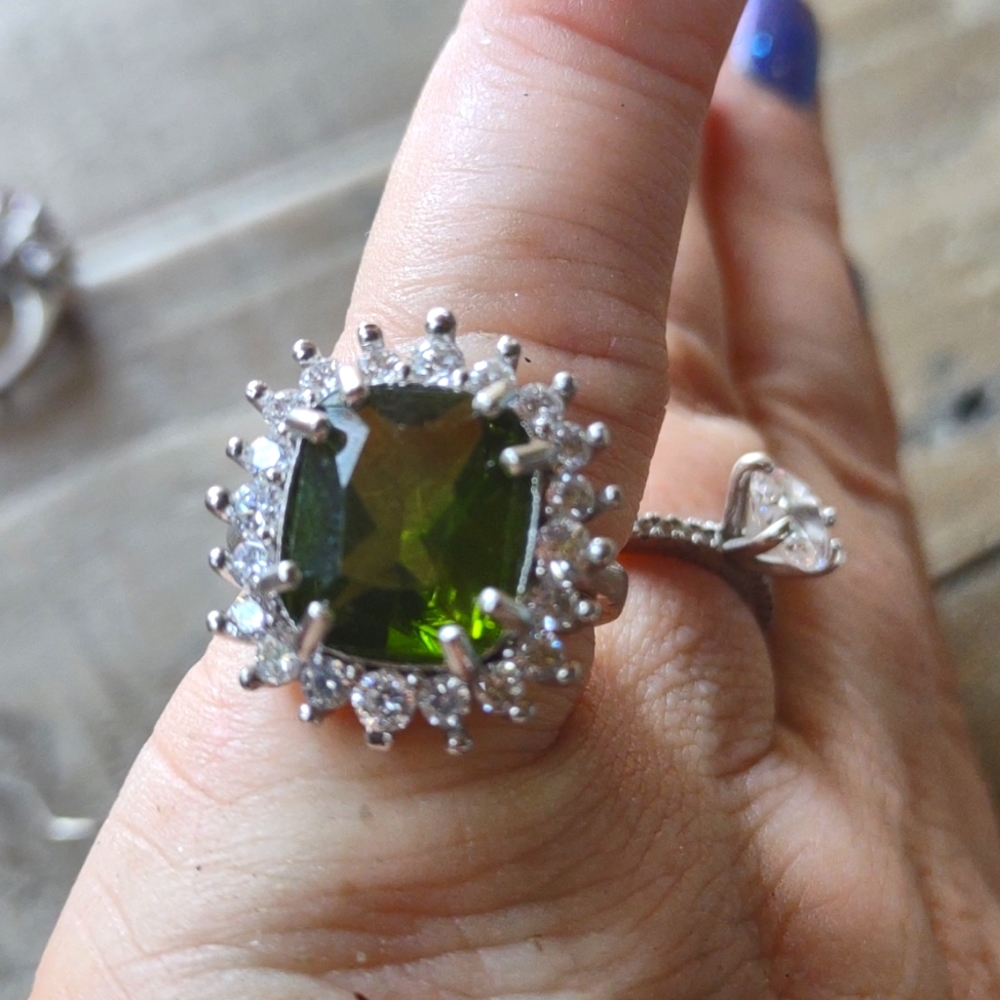 This is a lovely sterling silver peridot ring.  The main stone is an excellent s